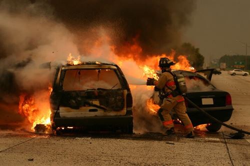 A firefighter putting out a fire on a car

AI-generated content may be incorrect.